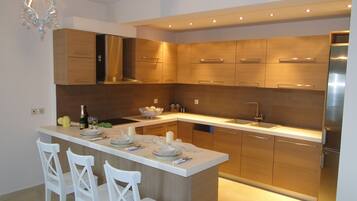 Villa, 4 Bedrooms | Shared kitchen facilities | Full-size fridge, oven, stovetop, dishwasher