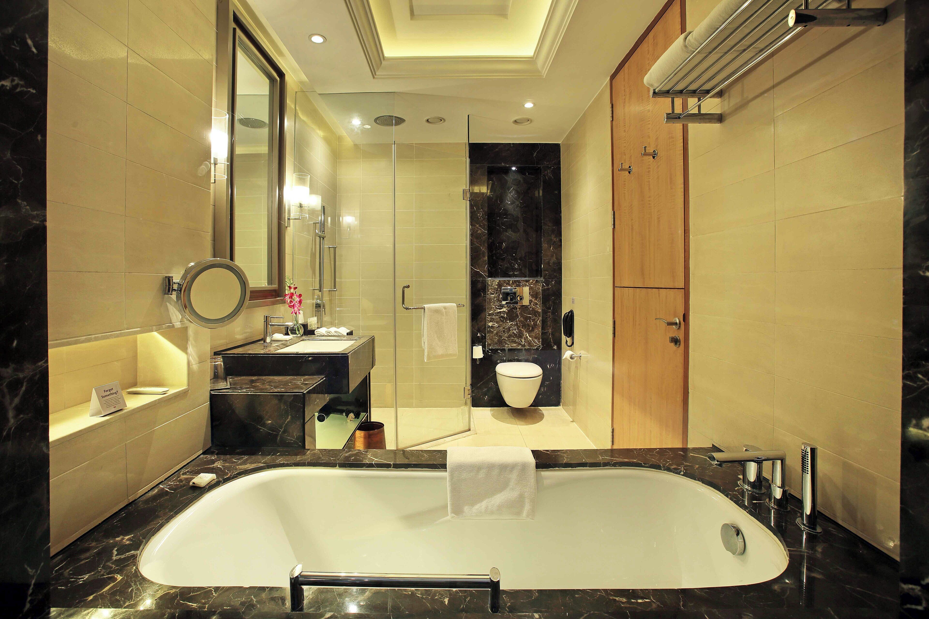 separate bathtub and shower, deep-soaking bathtub, rainfall showerhead