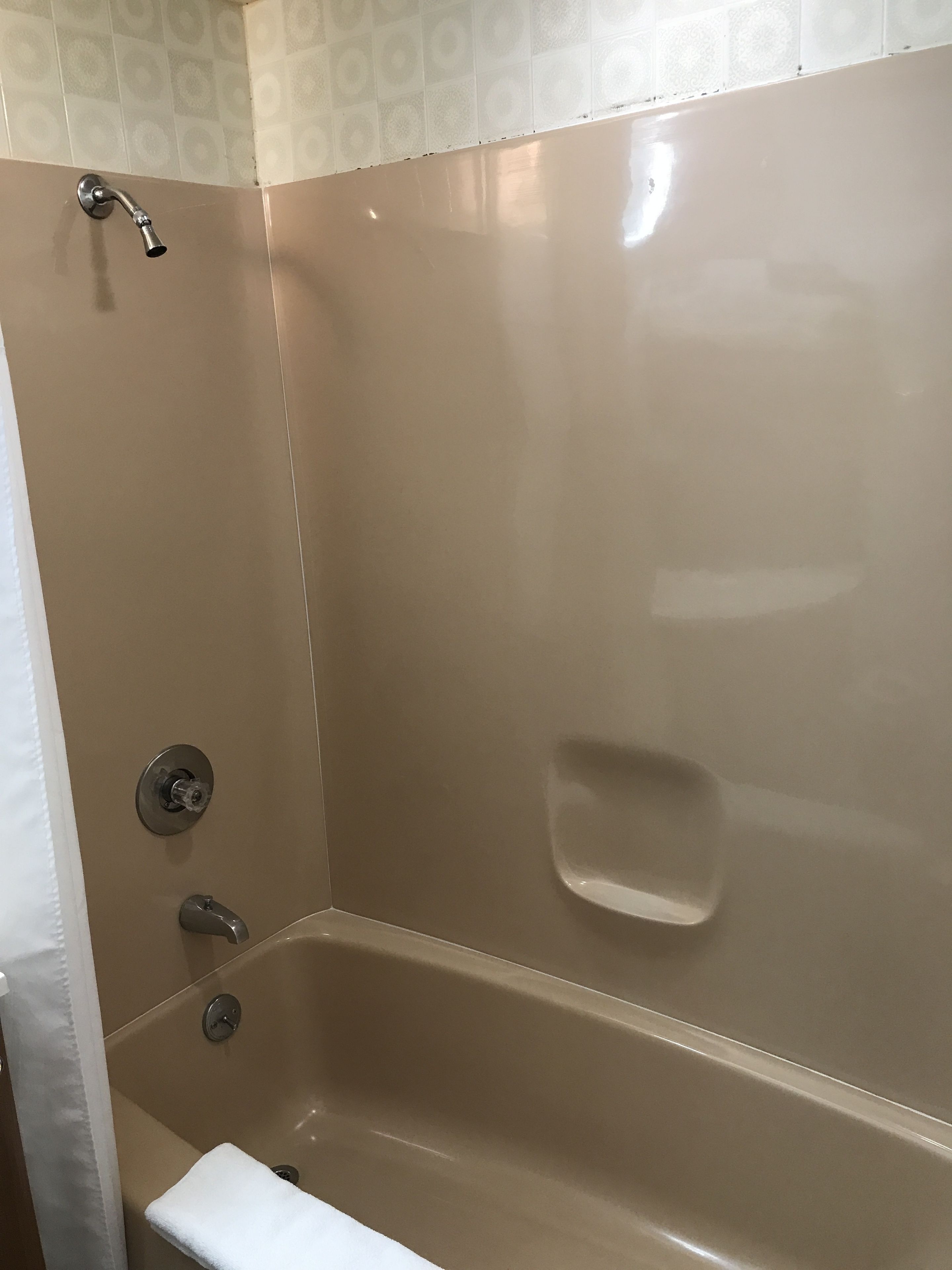 A bathroom with a bathtub, a shower, and a toilet.