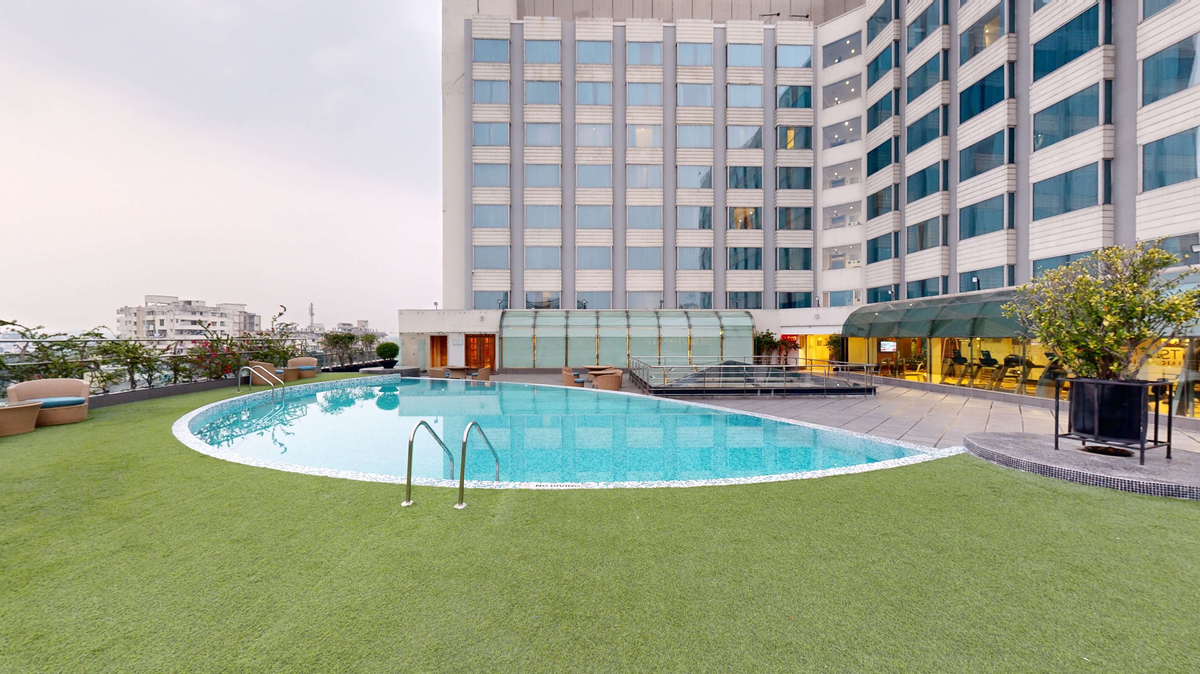 outdoor pool, pool umbrellas, pool loungers