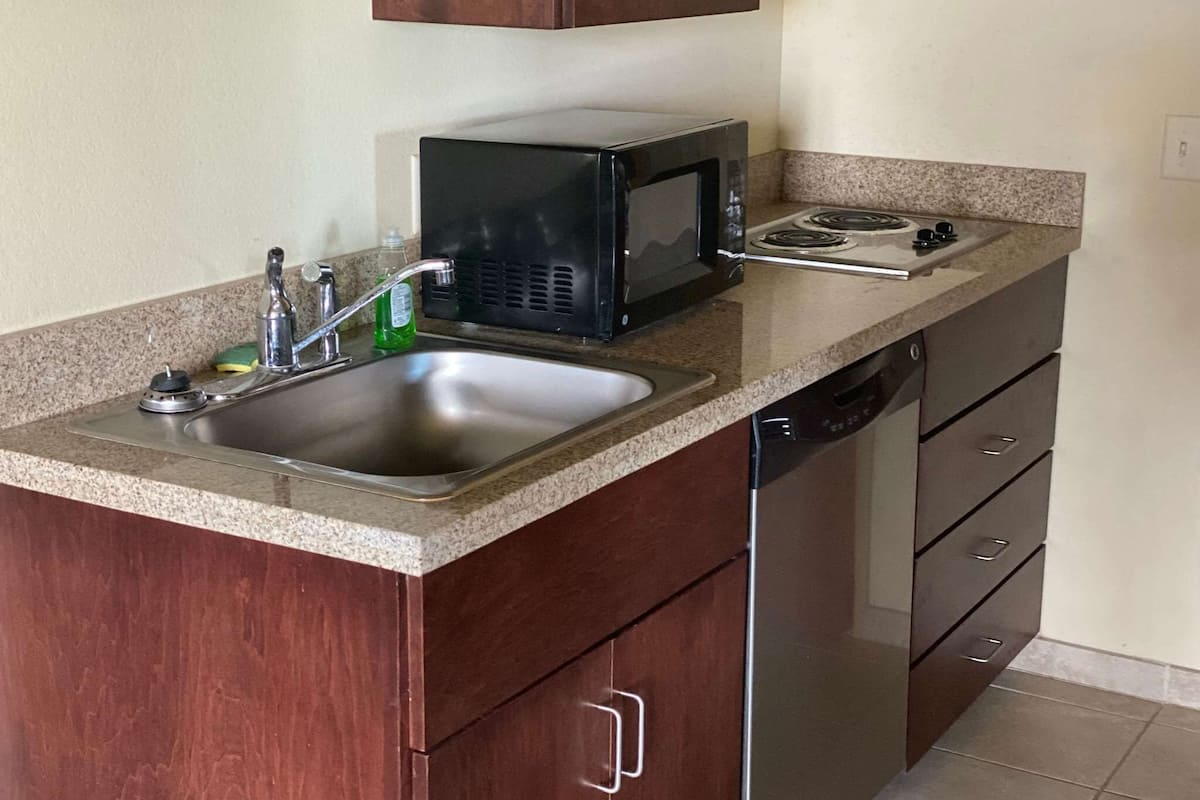 Suite, 1 King Bed, Non Smoking | Down comforters, in-room safe, desk, laptop workspace