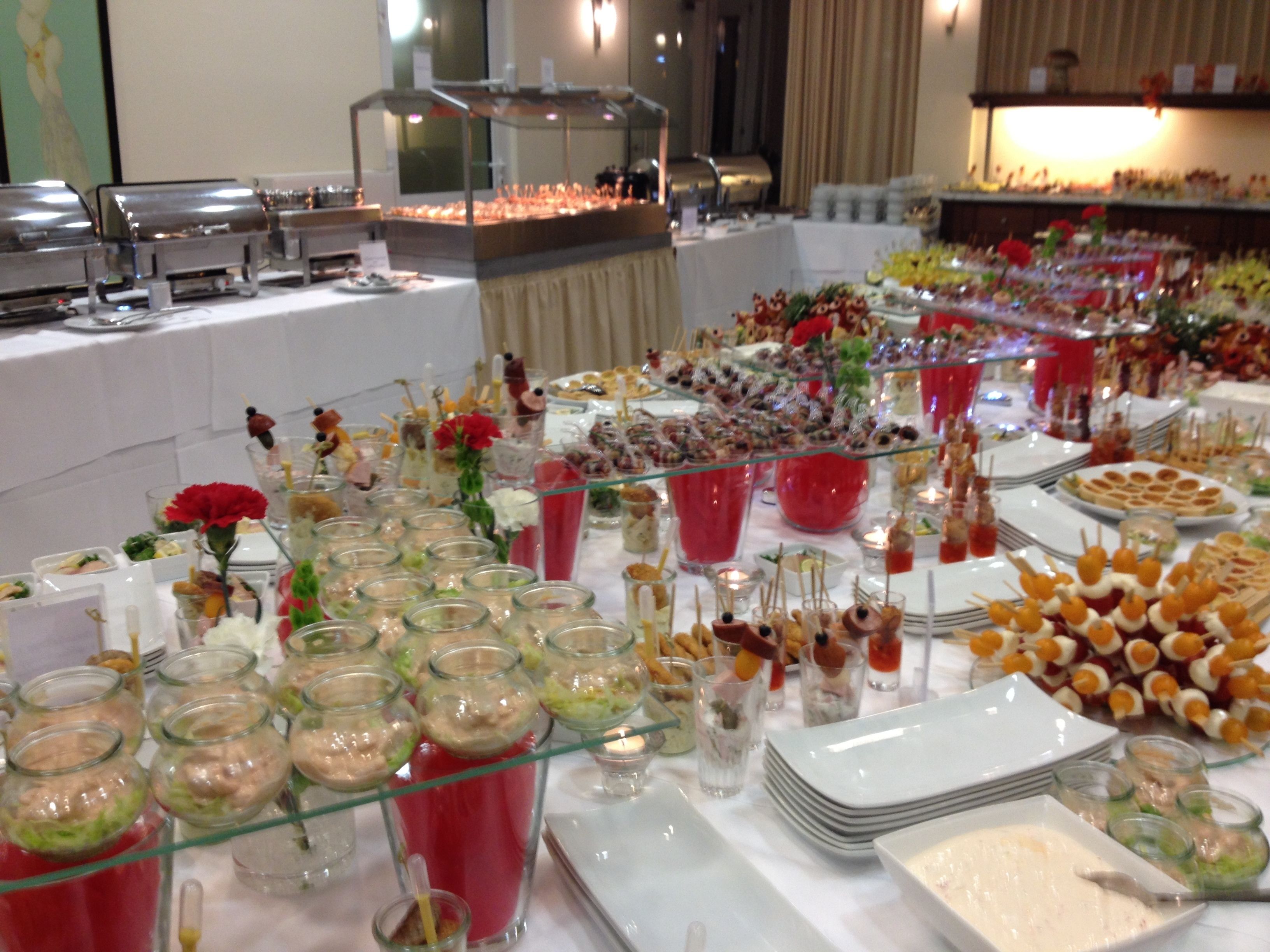 A buffet with various food items and drinks.