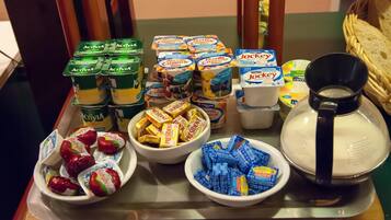 A tray with various dairy products including yogurt, cheese, and milk.
