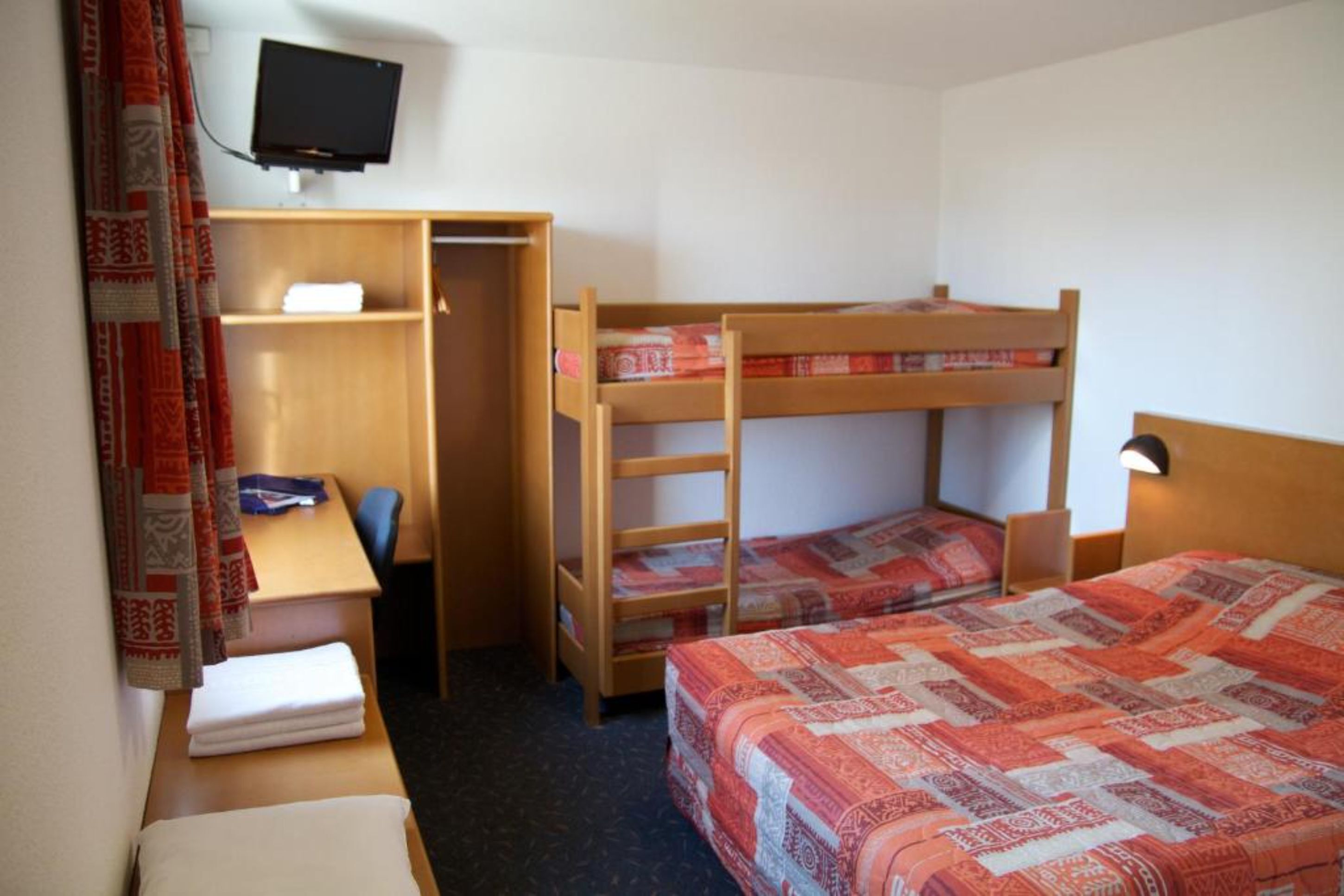 family room | desk, blackout curtains, soundproofing, free wifi