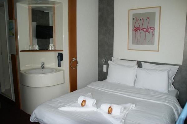 Standard Quadruple Room | Desk, blackout drapes, soundproofing, iron/ironing board (on request)