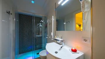 Shower, designer toiletries, hair dryer, slippers