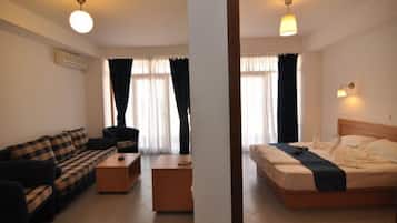 Family Apartment, Sea View | Minibar, in-room safe, laptop workspace, soundproofing