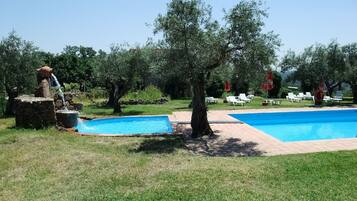 Seasonal outdoor pool, open 10:30 AM to 9:00 PM, pool umbrellas