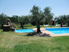 Seasonal outdoor pool, open 10:30 AM to 9:00 PM, pool umbrellas