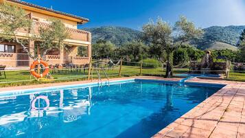 Seasonal outdoor pool, open 10:30 AM to 9:00 PM, pool umbrellas