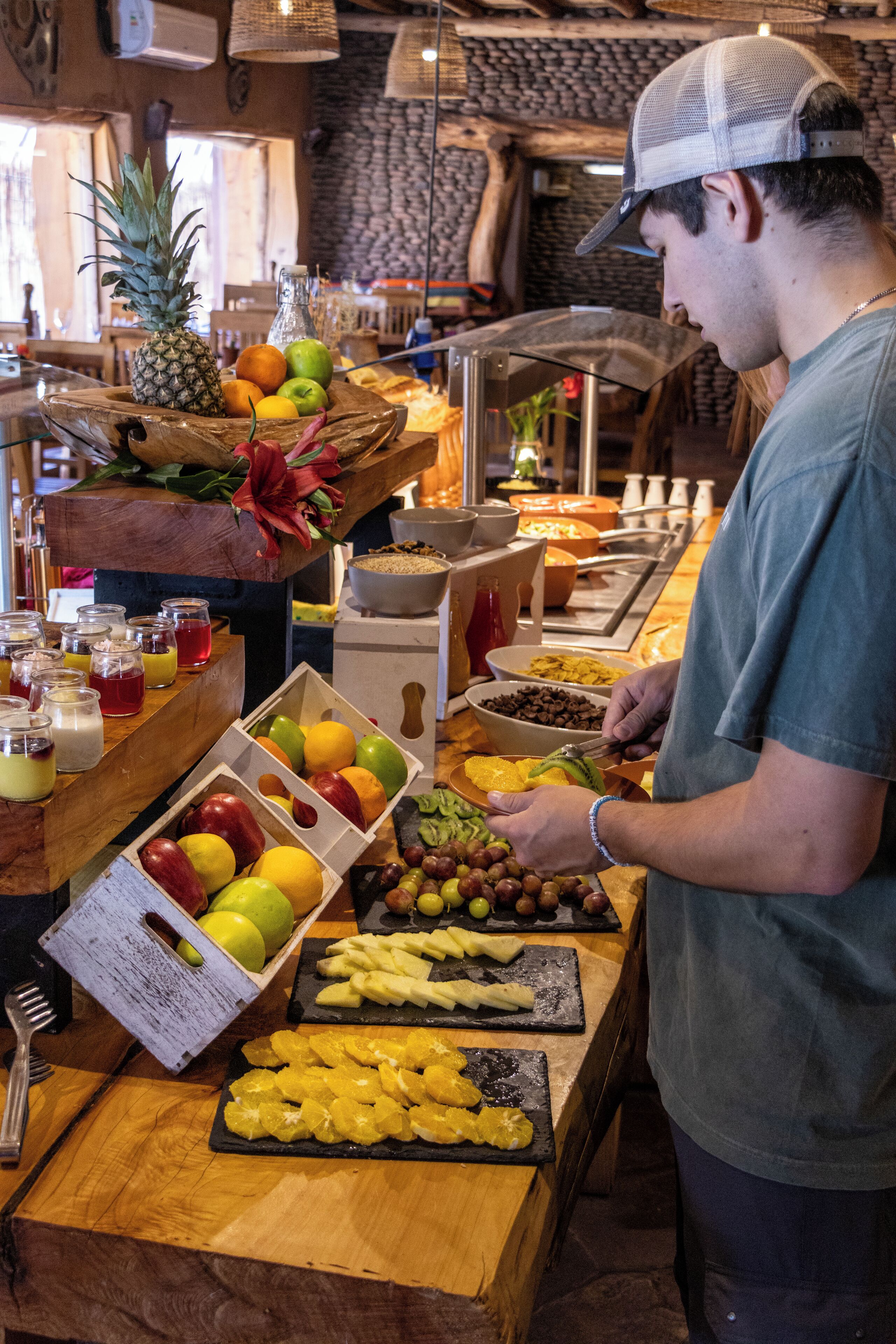 A buffet with various fruits and beverages.