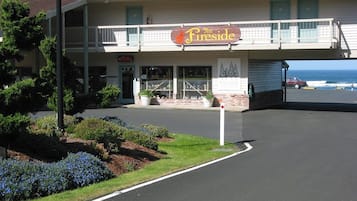 A motel with a sign reading "The Fireside" and a "Lobby" sign above the entrance.
