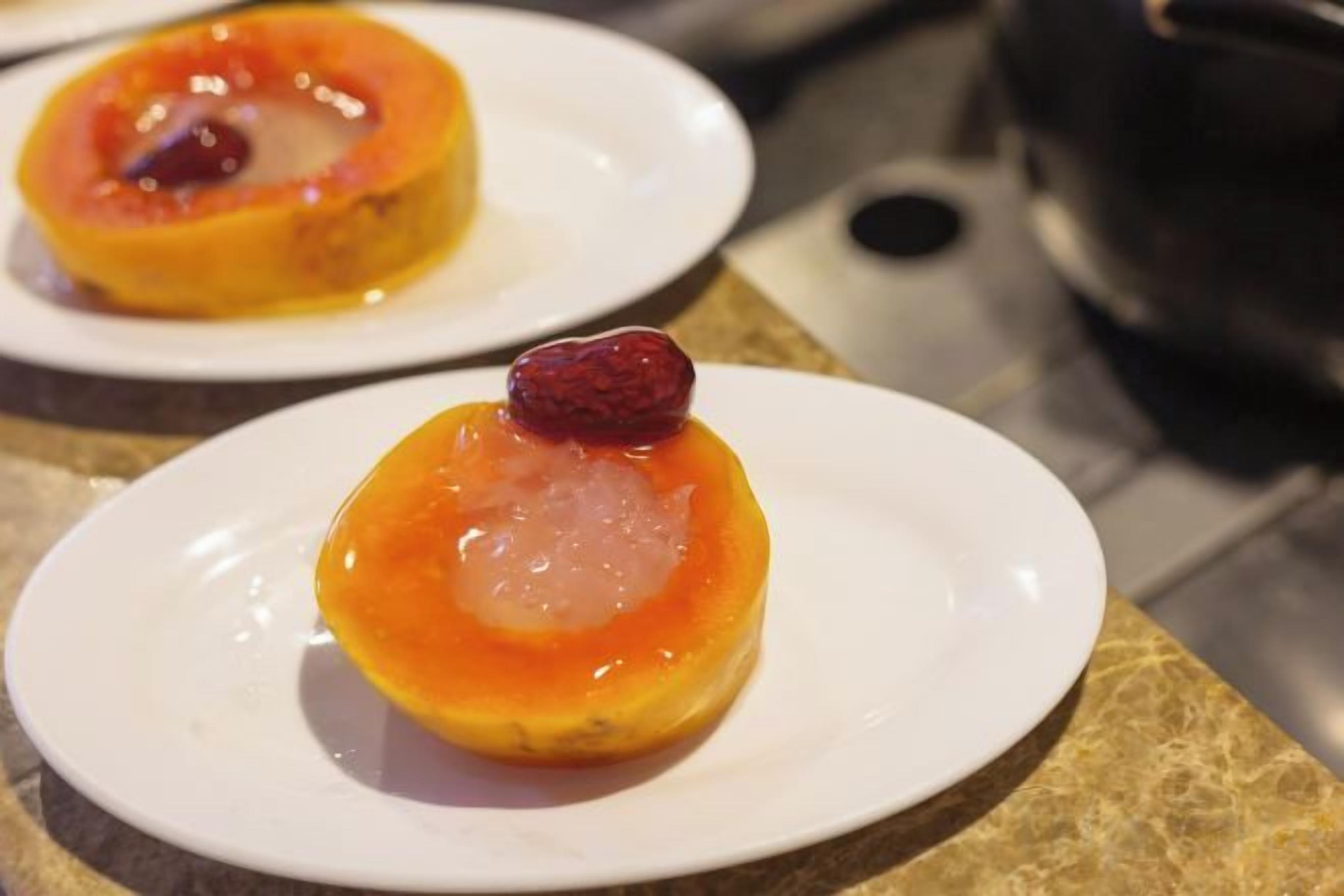 Two plates with desserts on a countertop.