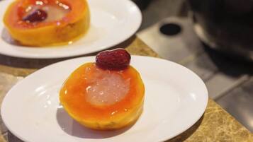 Two plates with desserts on a countertop.