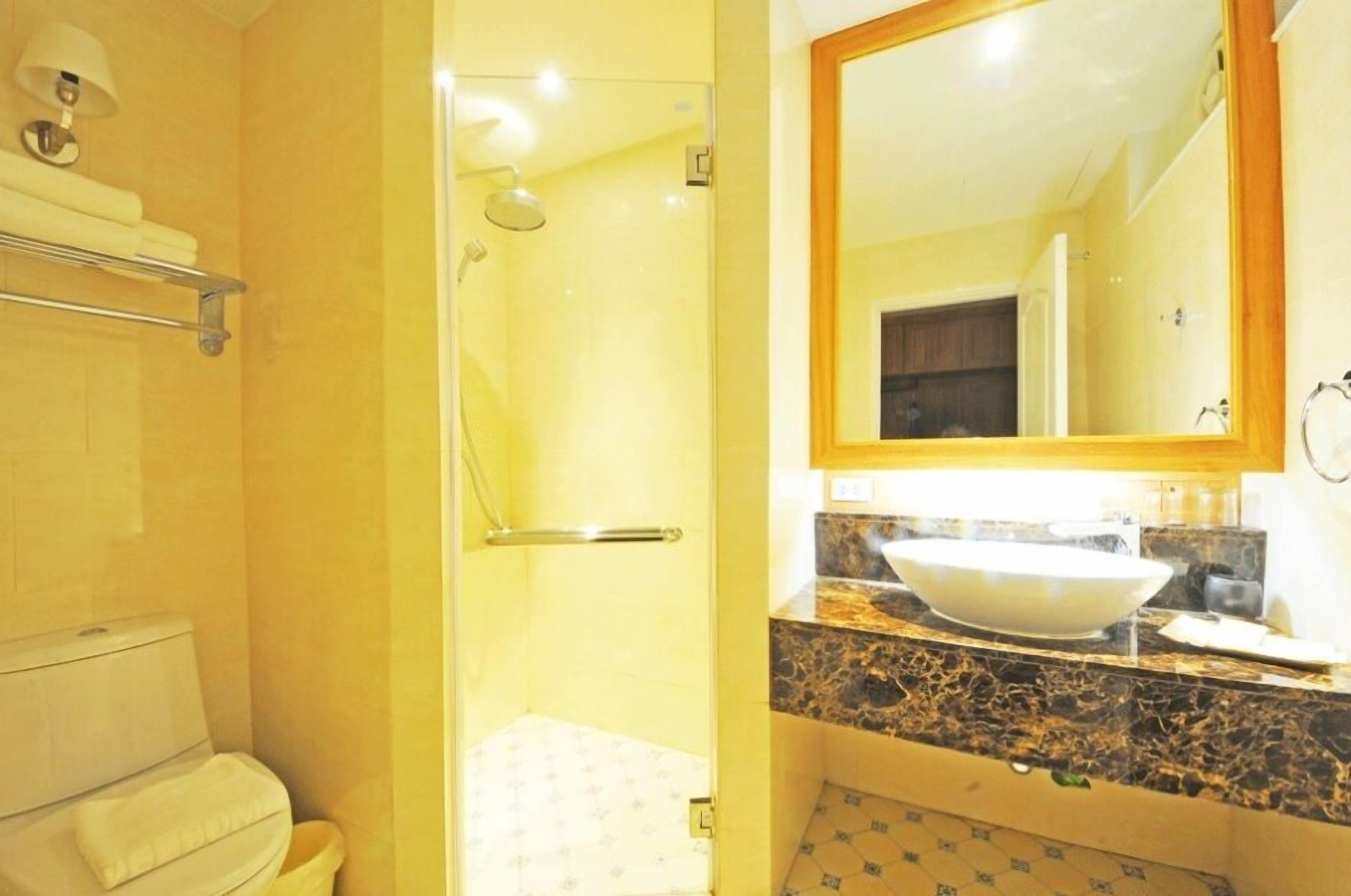 deluxe mountain view | bathroom | shower, free toiletries, hair dryer, slippers