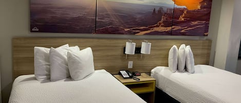 Pillowtop beds, desk, laptop workspace, blackout drapes