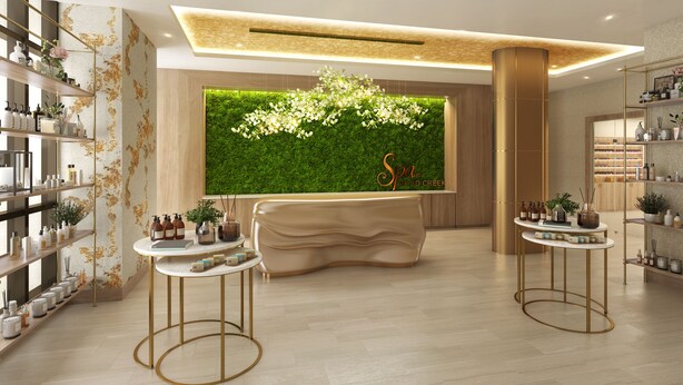 Interior de un spa moderno con una recepción, una pared verde y estantes con artículos de aseo.