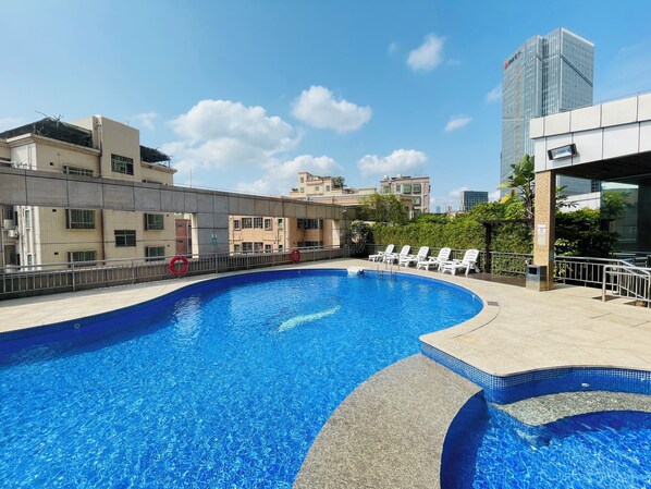 Outdoor pool, pool umbrellas, pool loungers