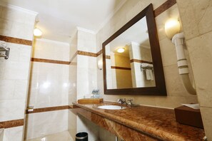 Shower, hair dryer, slippers, towels