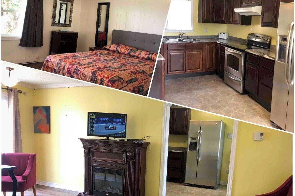Une chambre à coucher comprenant un lit, une cheminée, un téléviseur et un coin repas avec des chaises.