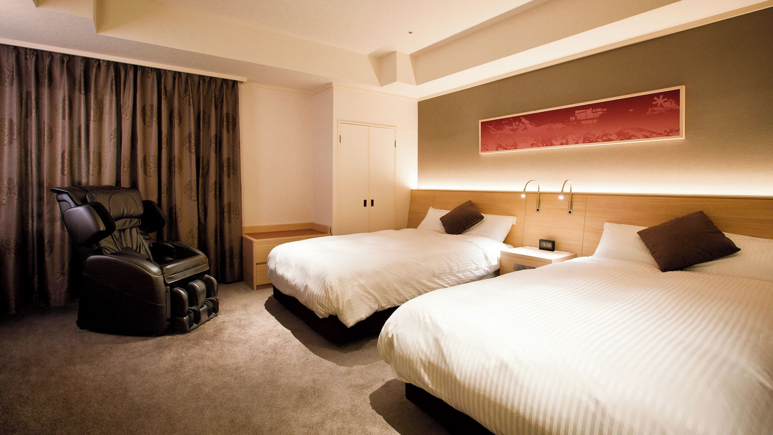 A hotel room with two beds, a massage chair, a nightstand, and a wall-mounted artwork.