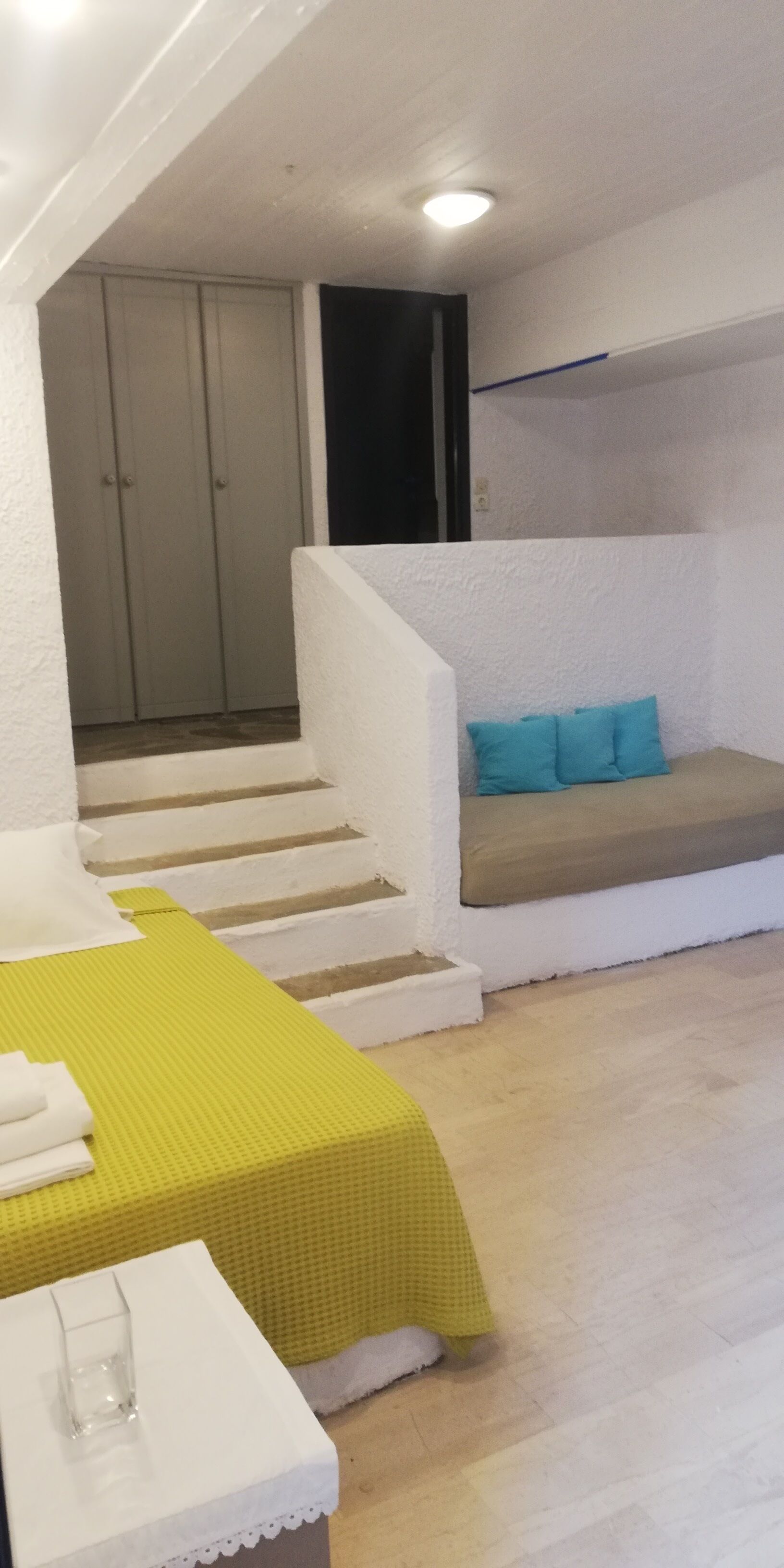 economy apartment | living area | lcd tv, ping pong, books