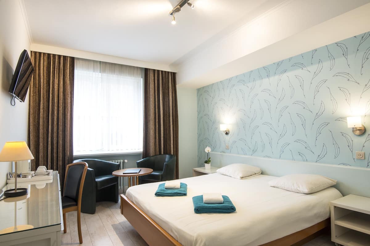 Familiekamer | Een bureau, verduisterende gordijnen, gratis wifi, beddengoed