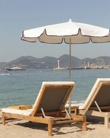 Beach nearby, white sand, free beach shuttle, beach umbrellas