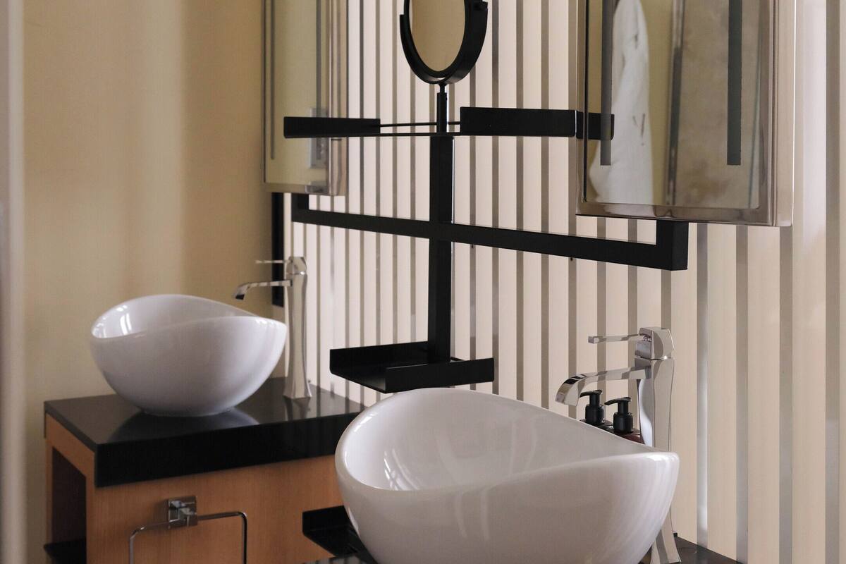 superior room | bathroom | rainfall showerhead, designer toiletries, hair dryer, bathrobes