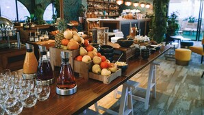 A buffet table with various fruits, beverages, and dishes. - Five Seas by Inwood Hotels (Cannes)