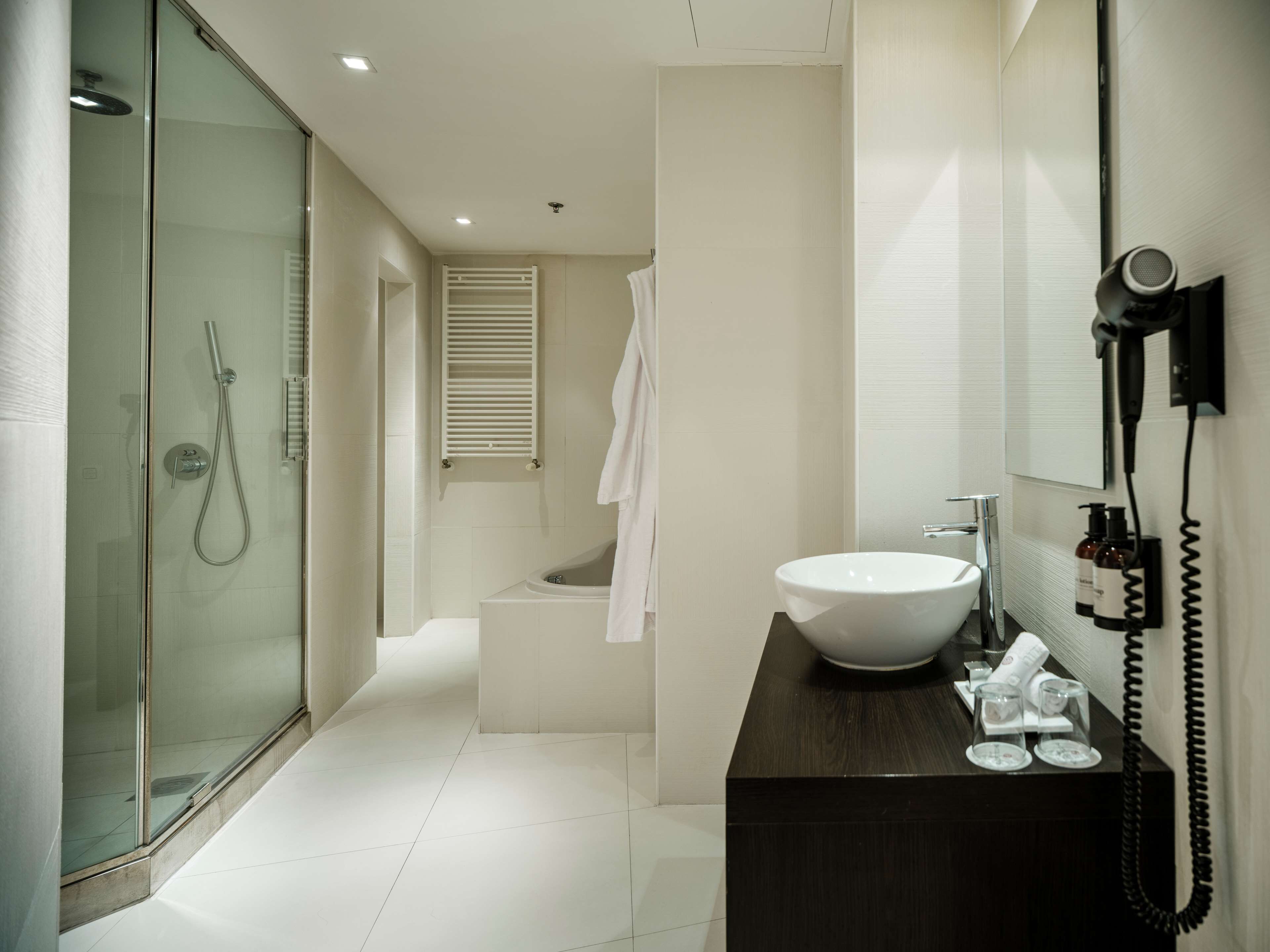 rainfall showerhead, eco-friendly toiletries, hair dryer, towels