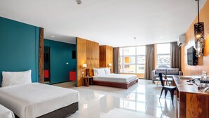 A modern hotel room with two beds, a desk, a chair, and a large window offering a city view. - MeStyle Place Hotel (Bangkok)