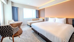 A hotel room with a large bed, a sofa, a chair, and a desk. - Richmond Hotel Fukuoka Tenjin (Fukuoka)