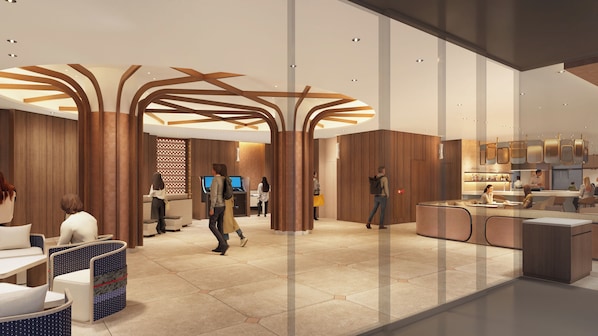 A modern hotel lobby with a reception desk, seating area, and a bar.
