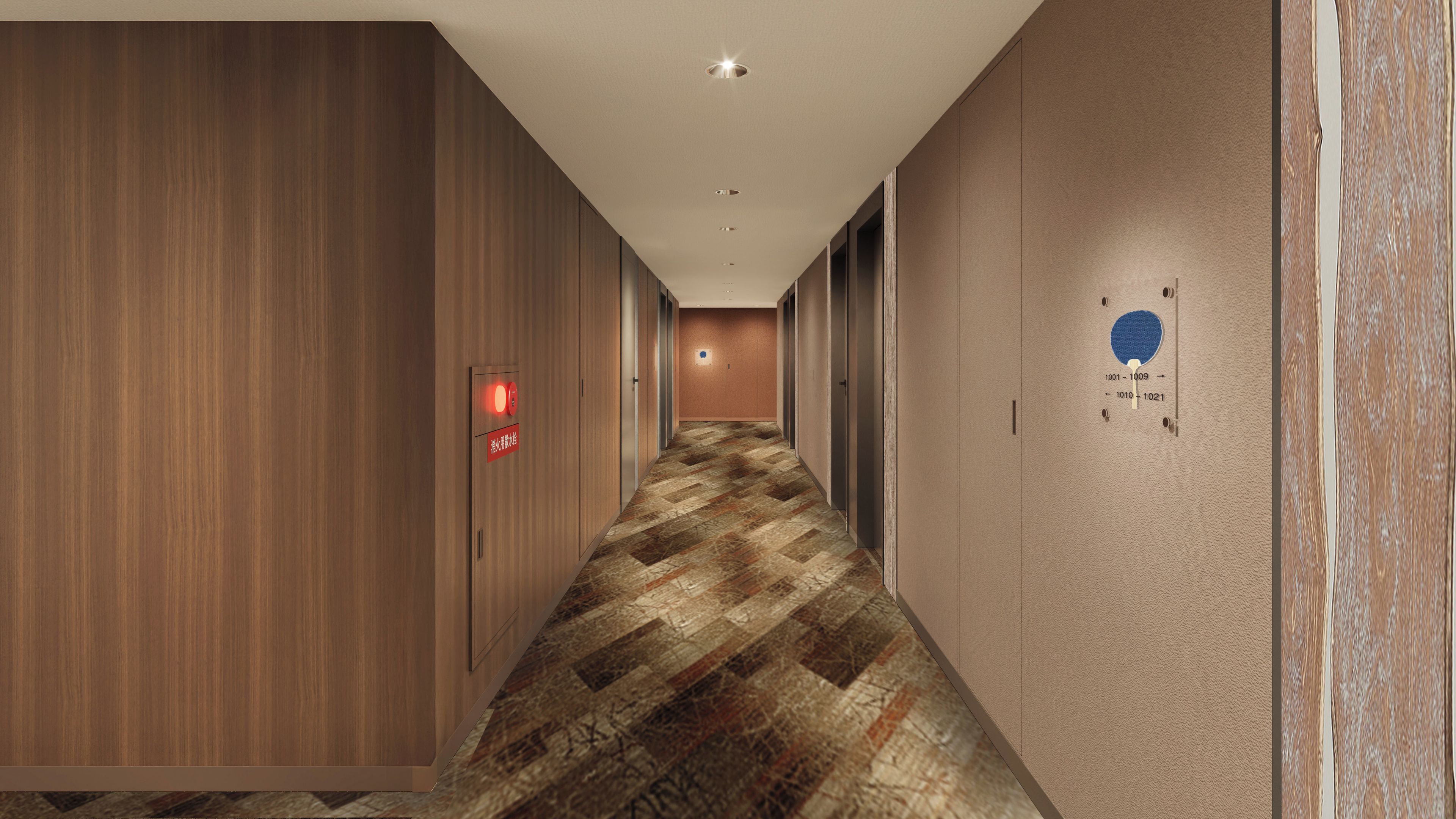 A hotel hallway with wooden paneling, a patterned carpet, and a red emergency exit sign.