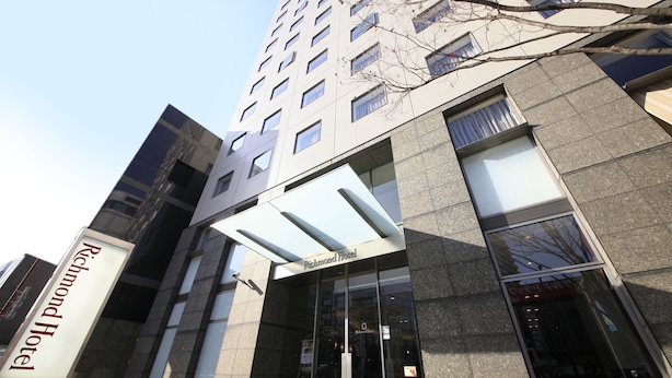 The exterior of the Richmond Hotel with a modern glass facade and a prominent entrance. - Richmond Hotel Fukuoka Tenjin (Fukuoka)