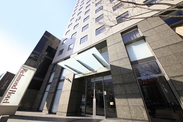 The exterior of the Richmond Hotel with a modern glass facade and a prominent entrance. - Richmond Hotel Fukuoka Tenjin (Fukuoka)