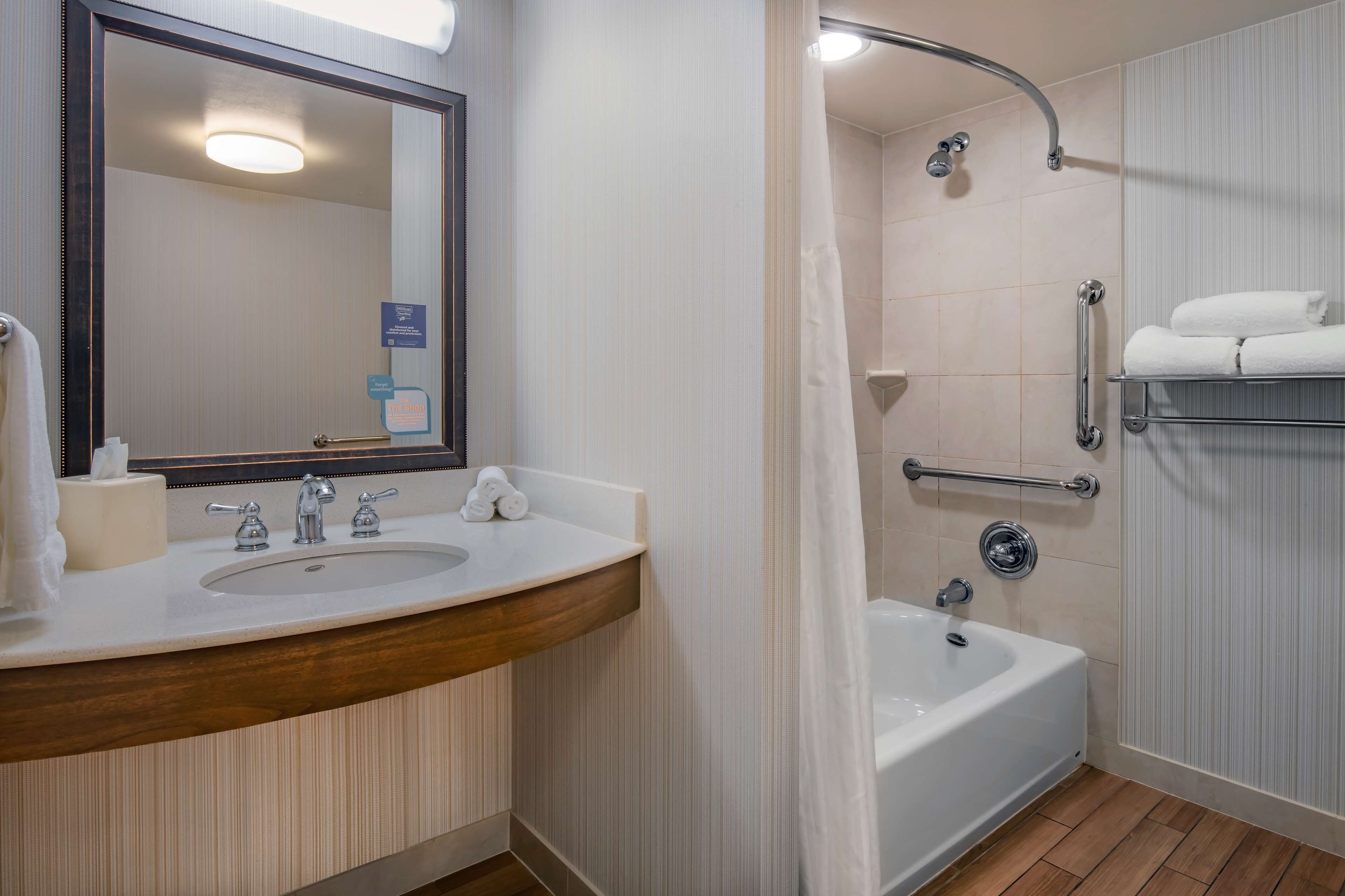 deluxe suite, 1 king bed | bathroom | free toiletries, hair dryer, towels