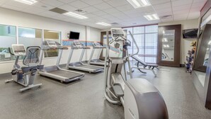 A fitness center with treadmills, an elliptical, and a stationary bike.