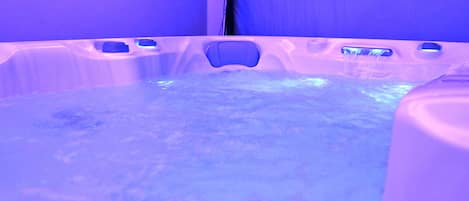A hot tub with a blue light.