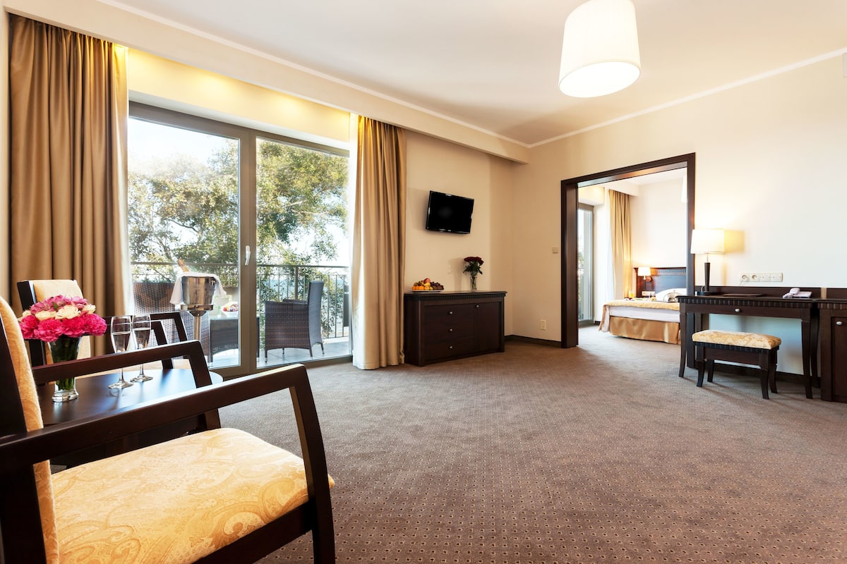 Superior Apartment, Sea View | Living area | Flat-screen TV