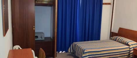 Habitación triple | Caja de seguridad en la habitación, camas extra y wifi gratis