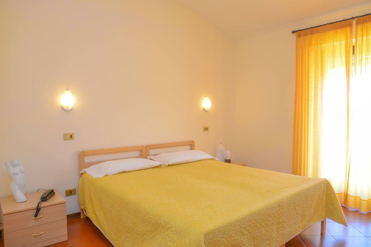 family room, connecting rooms | frette italian sheets, select comfort beds, desk, iron/ironing board