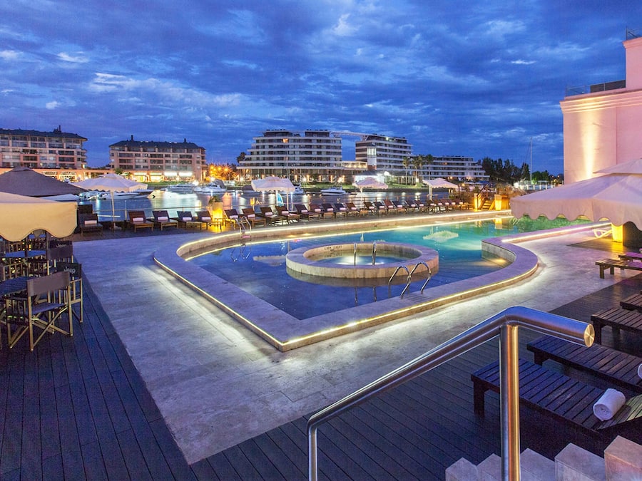 Seasonal outdoor pool, open 9:00 AM to 8:00 PM, pool umbrellas