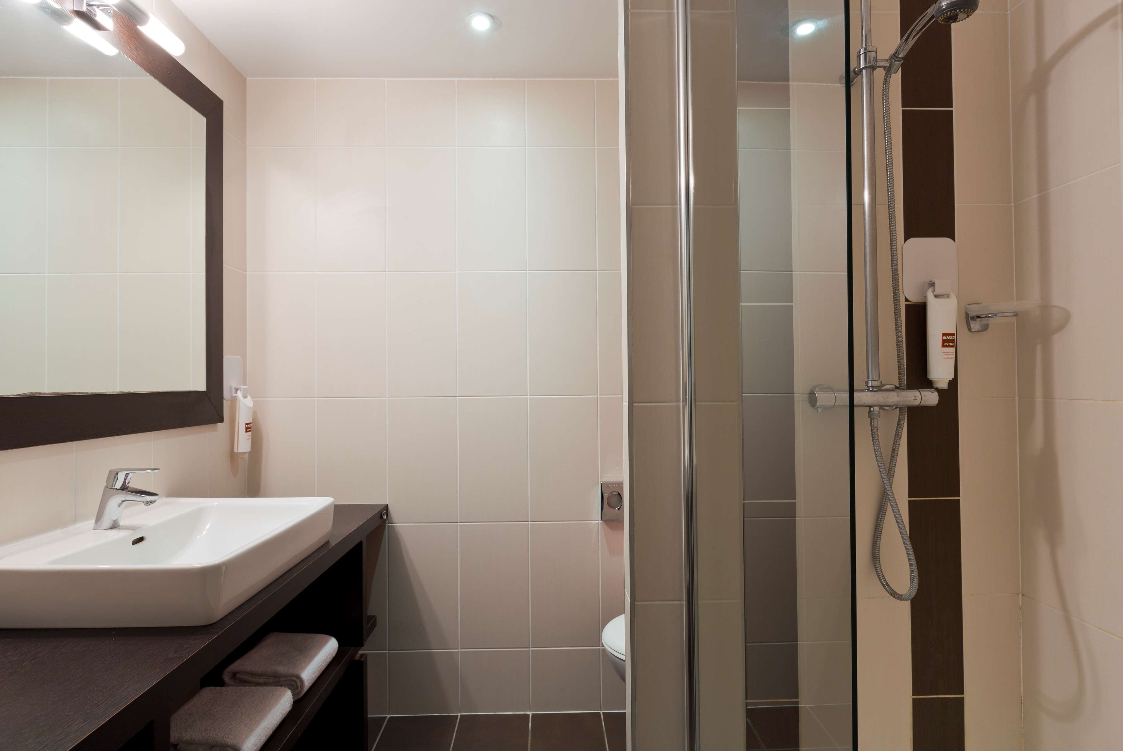 eco-friendly toiletries, hair dryer, towels