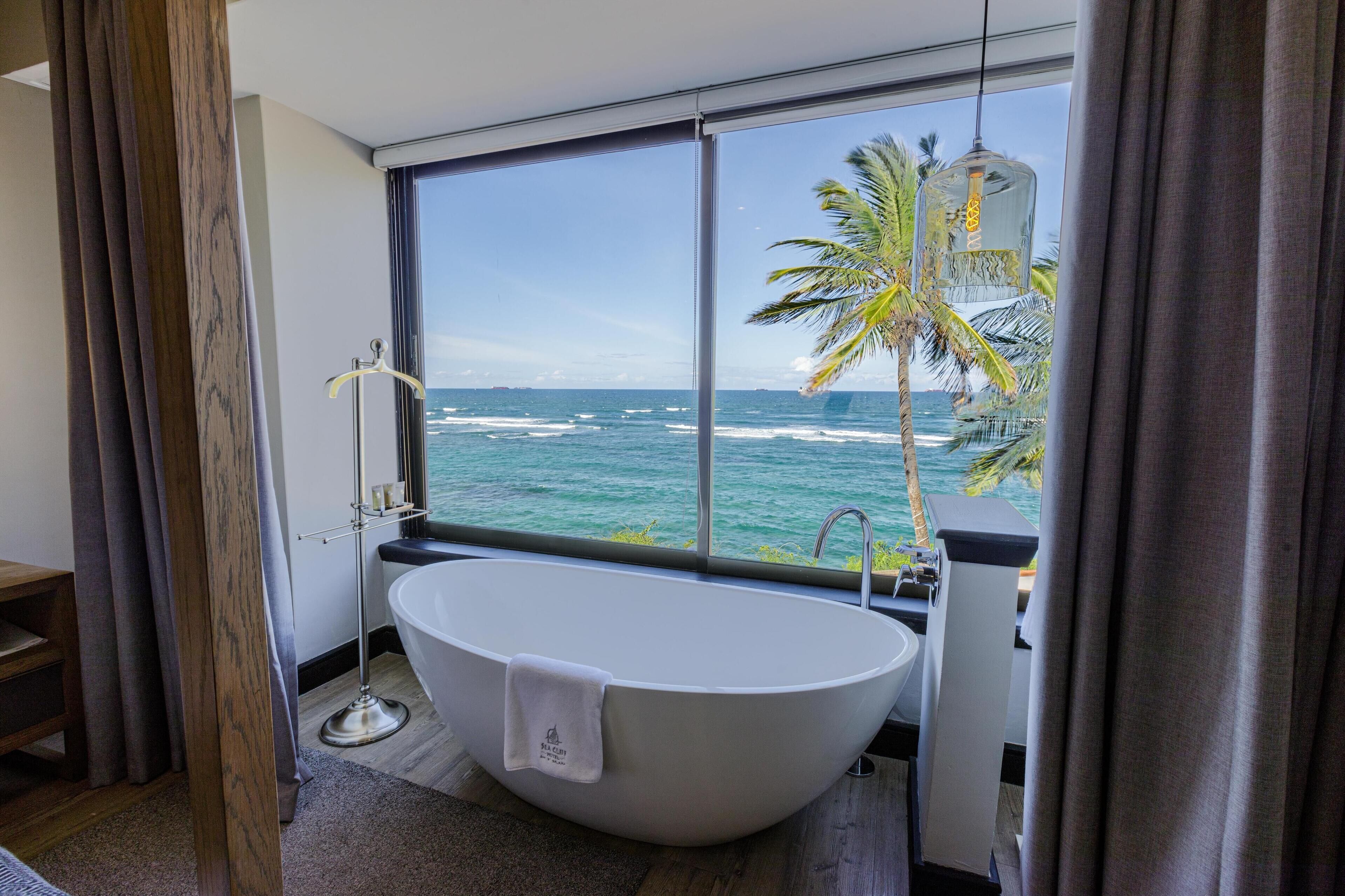 suite (amani) | bathroom | shower, hydromassage showerhead, free toiletries, bathrobes