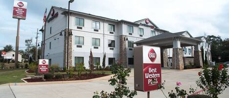 A Best Western Plus hotel with a modern design, featuring a covered entrance and multiple windows.