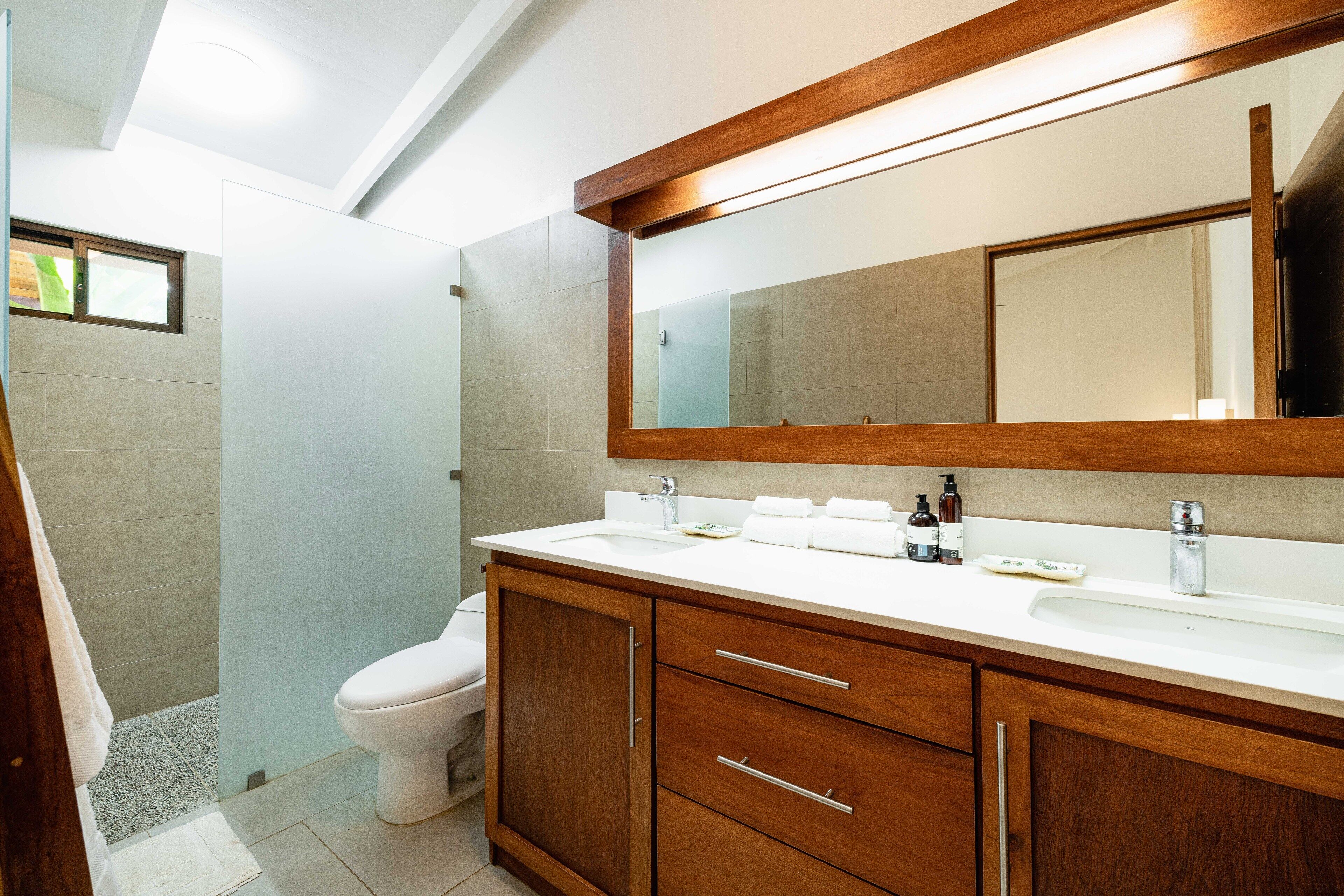 classic studio suite | bathroom | shower, rainfall showerhead, towels