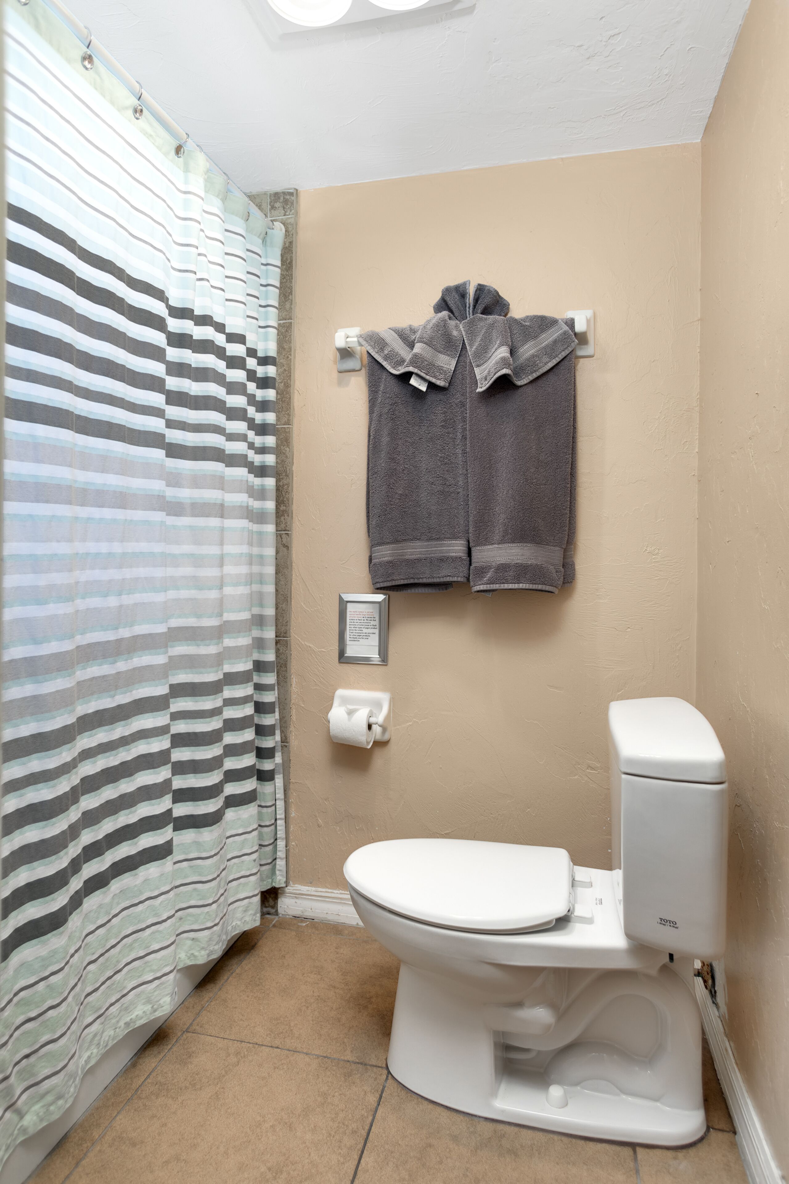 standard room, 1 queen bed | bathroom | hair dryer, towels