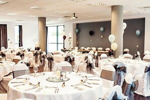 A banquet hall with round tables set for a formal event, featuring white tablecloths, silverware, and glassware. - Leonardo Hotel Newcastle Quayside (Gateshead)